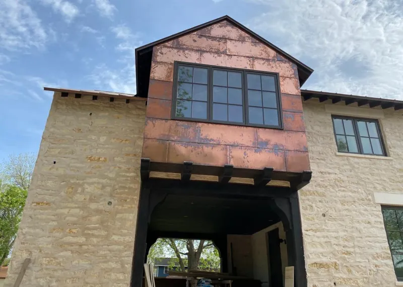 Copper metal panel facade on a stone building for Roof Repair in Waldwick